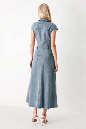 Woman wearing acid washed denim midi dress featuring collar with V neck, cap sleeve, front button down, pockets and circle skirt | FREEMARKET