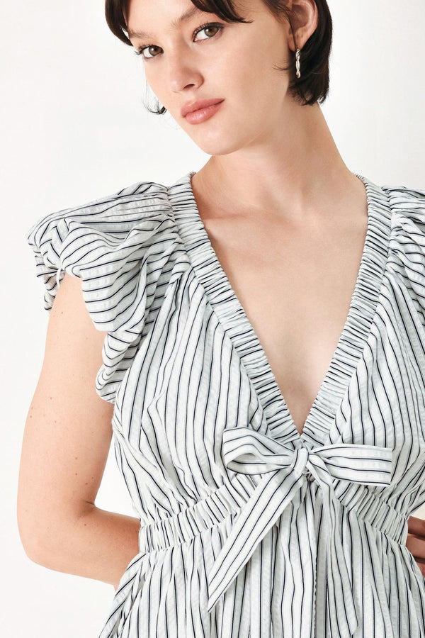 A striped woven midi dress featuring V neckline, short balloon sleeves, front tie, elastic at empire and full skirt