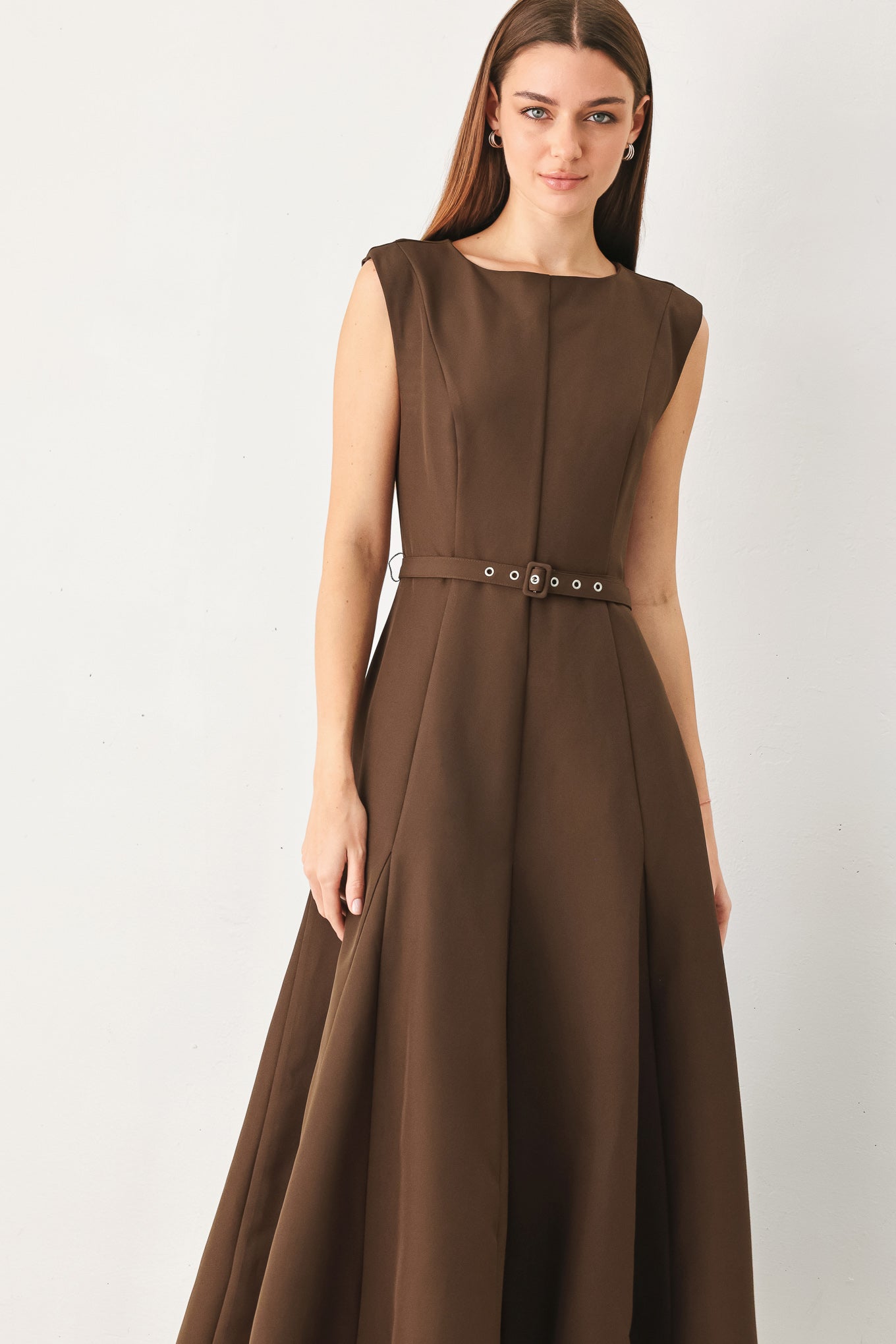 Woman wearing a brown woven midi dress featuring round neckline, sleeveless, self belt, full circle skirt and back zipper closure | FREEMARKET