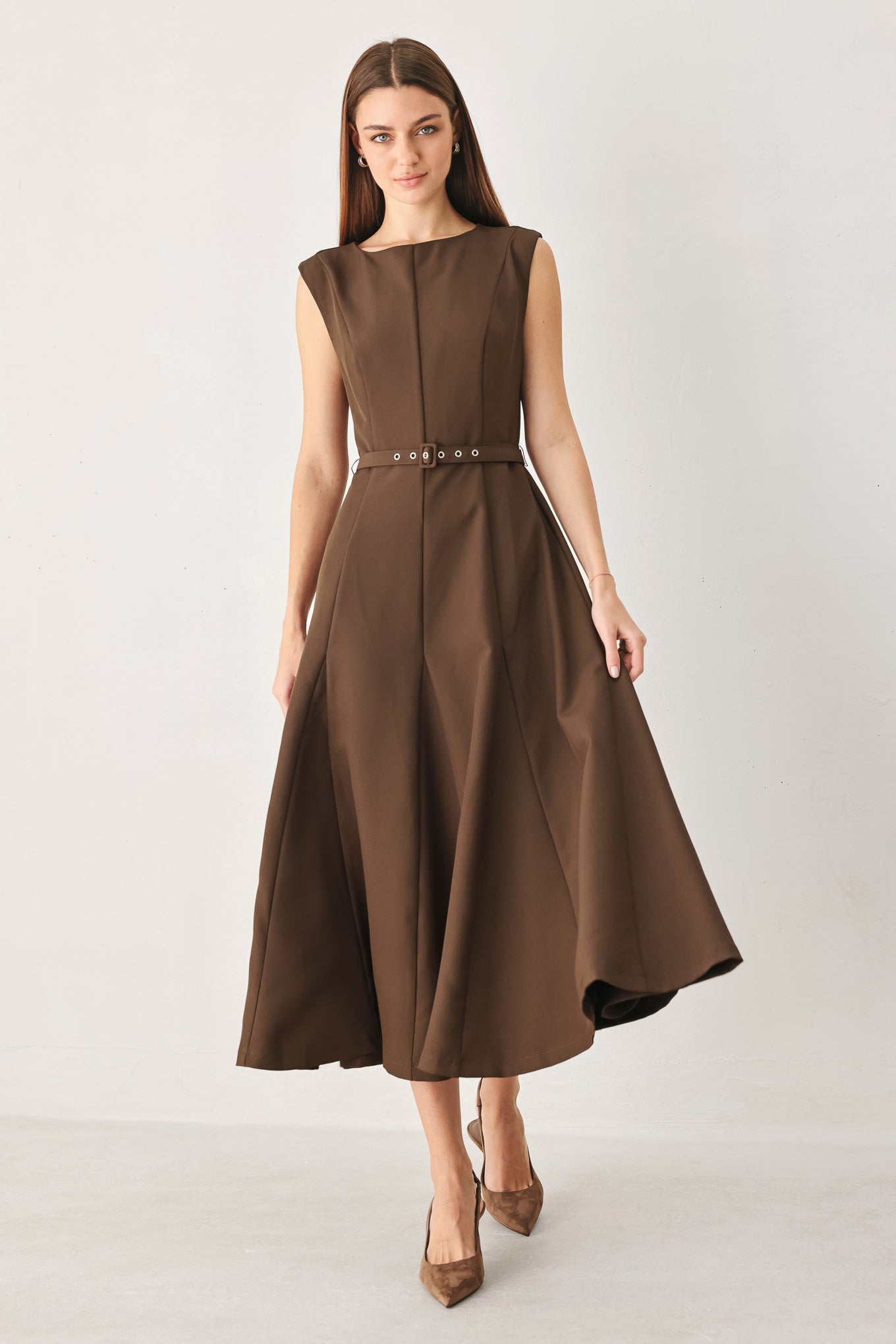 Woman wearing a brown woven midi dress featuring round neckline, sleeveless, self belt, full circle skirt and back zipper closure | FREEMARKET