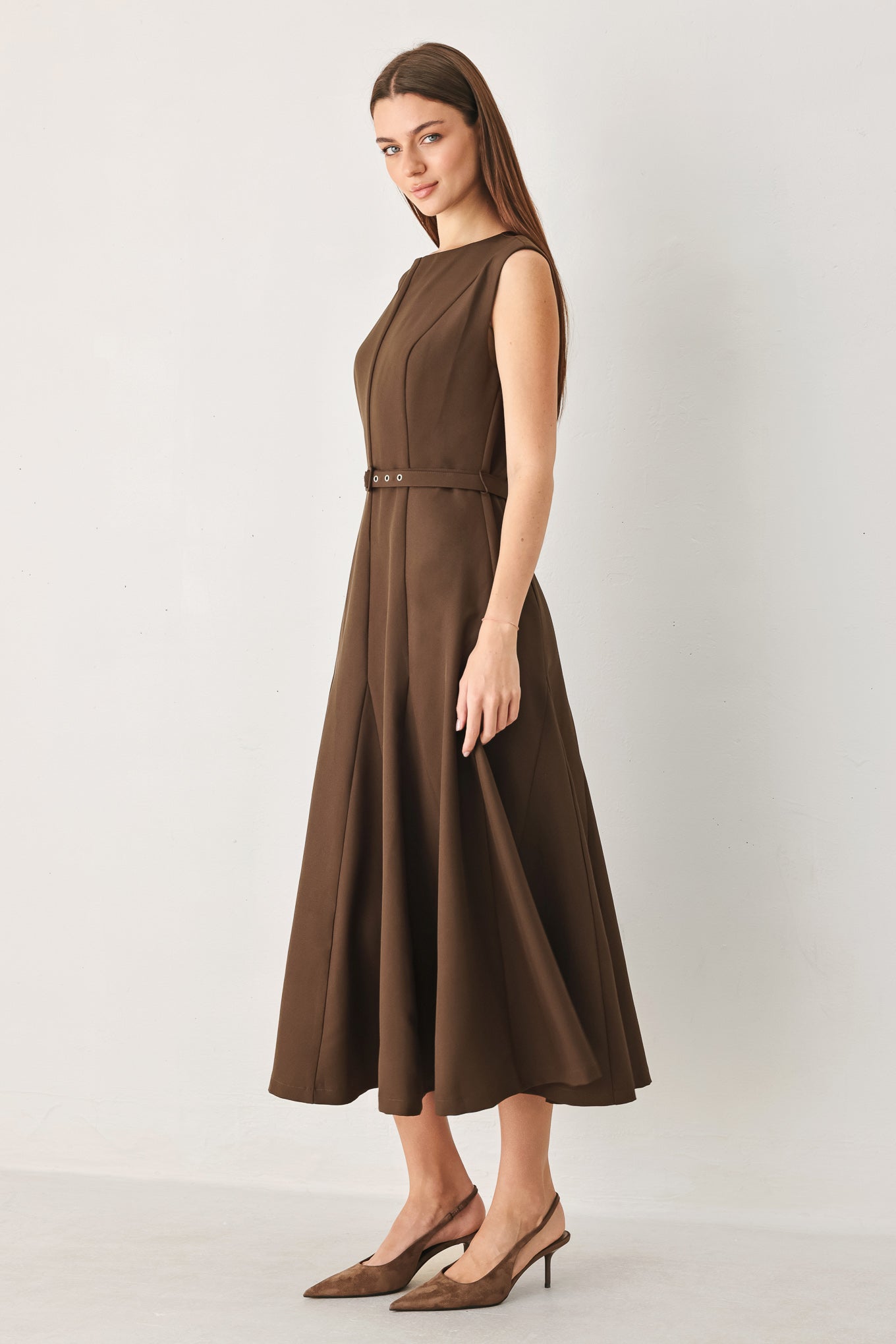 Woman wearing a brown woven midi dress featuring round neckline, sleeveless, self belt, full circle skirt and back zipper closure | FREEMARKET