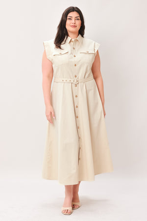 Woman wearing a beige dress with buttons on a white background | FREEMARKET | Flying Tomato