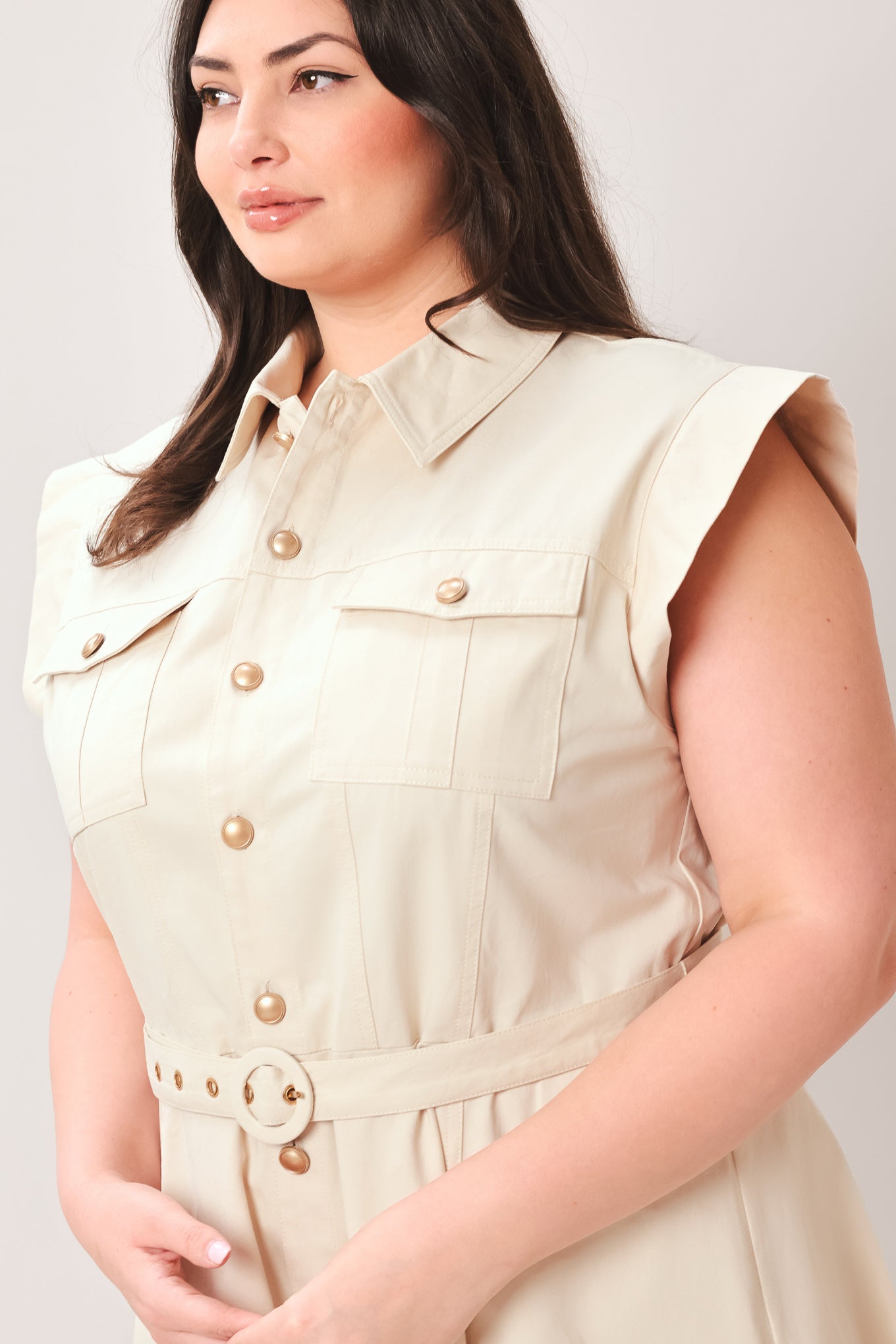 Woman wearing a beige dress with buttons on a white background | FREEMARKET | Flying Tomato