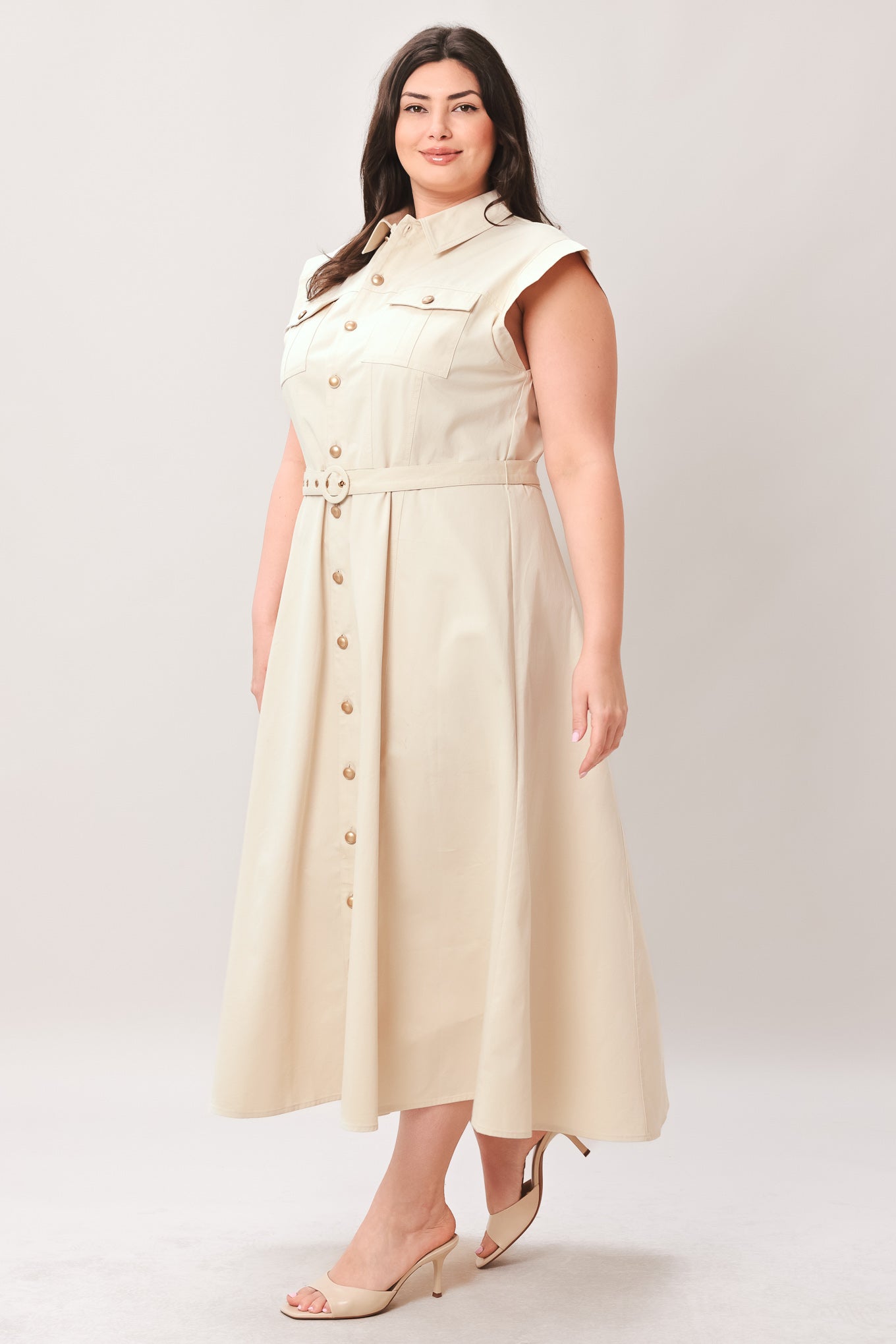 Woman wearing a beige dress with buttons on a white background | FREEMARKET | Flying Tomato