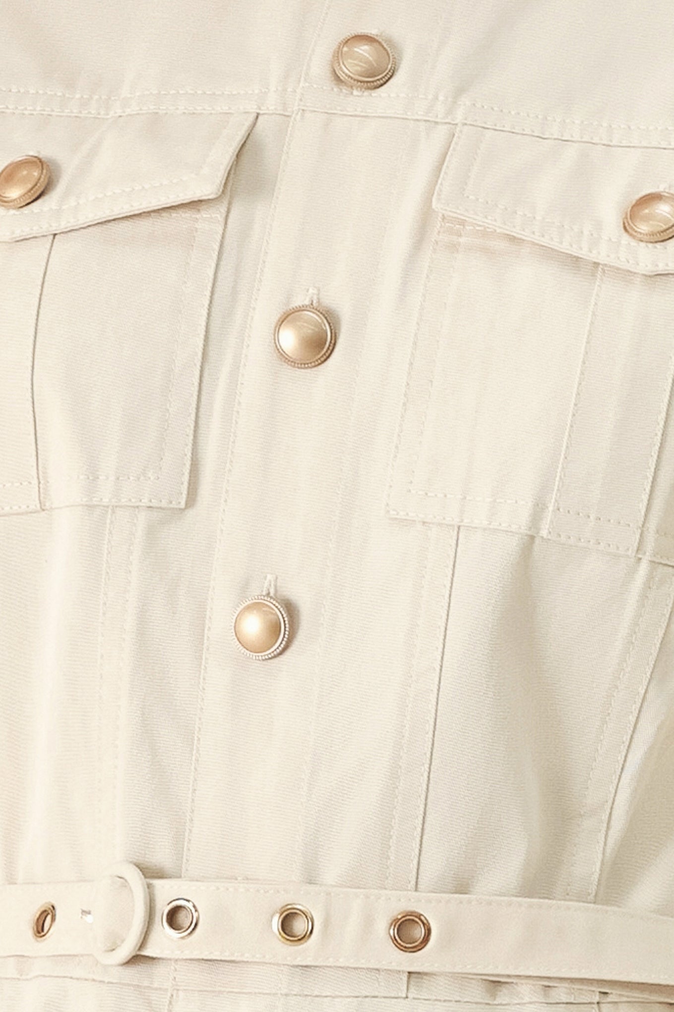 A solid woven shirt dress with front pocket, self belt and closure