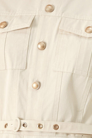 Closeup of a solid woven shirt dress with front pocket, self belt and closure | FREEMARKET | Flying Tomato