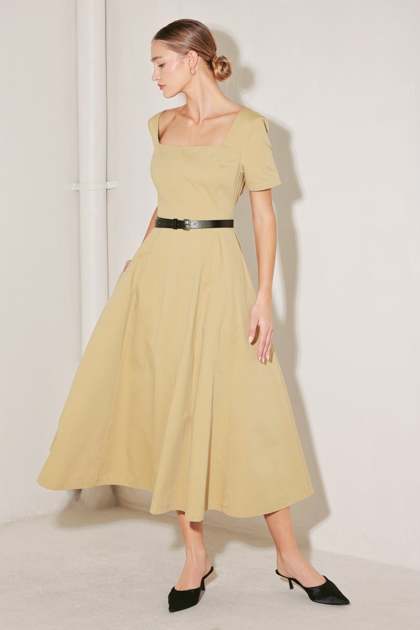 
A solid woven midi dress featuring square neckline, short sleeve, contrasting belt, full circle skirt and back zipper closure

Details:

Self : 100% Cotton

Size &amp; Fit

- Model is 5`8" And Wearing Size Small
- Measurements Taken From Size Small
- Approx. Length: 50"