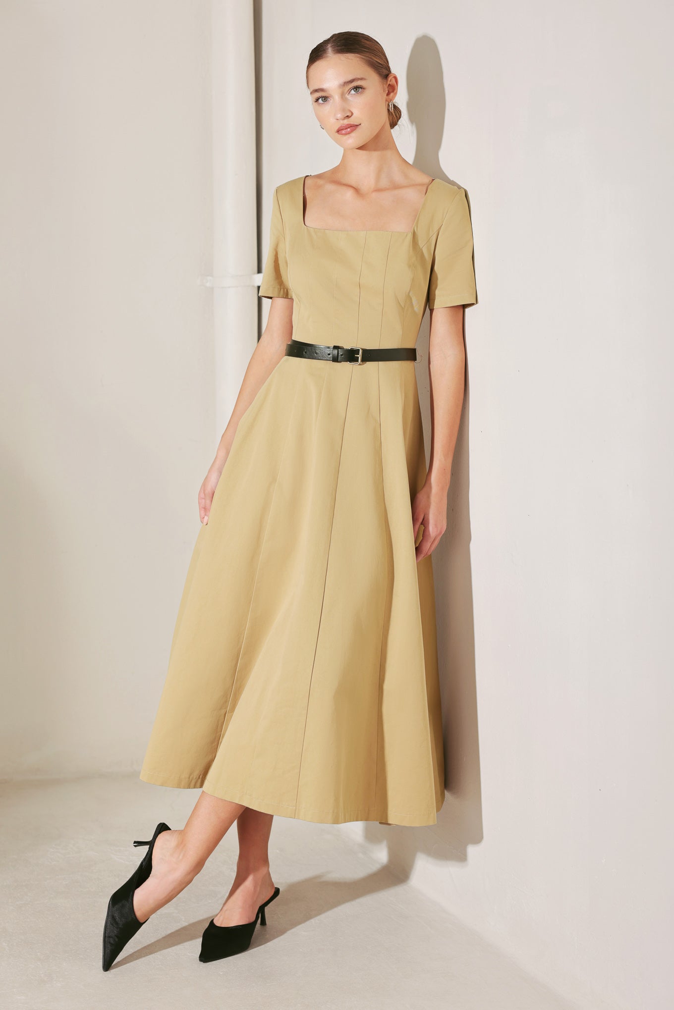 
A solid woven midi dress featuring square neckline, short sleeve, contrasting belt, full circle skirt and back zipper closure

Details:

Self : 100% Cotton

Size &amp; Fit

- Model is 5`8" And Wearing Size Small
- Measurements Taken From Size Small
- Approx. Length: 50"