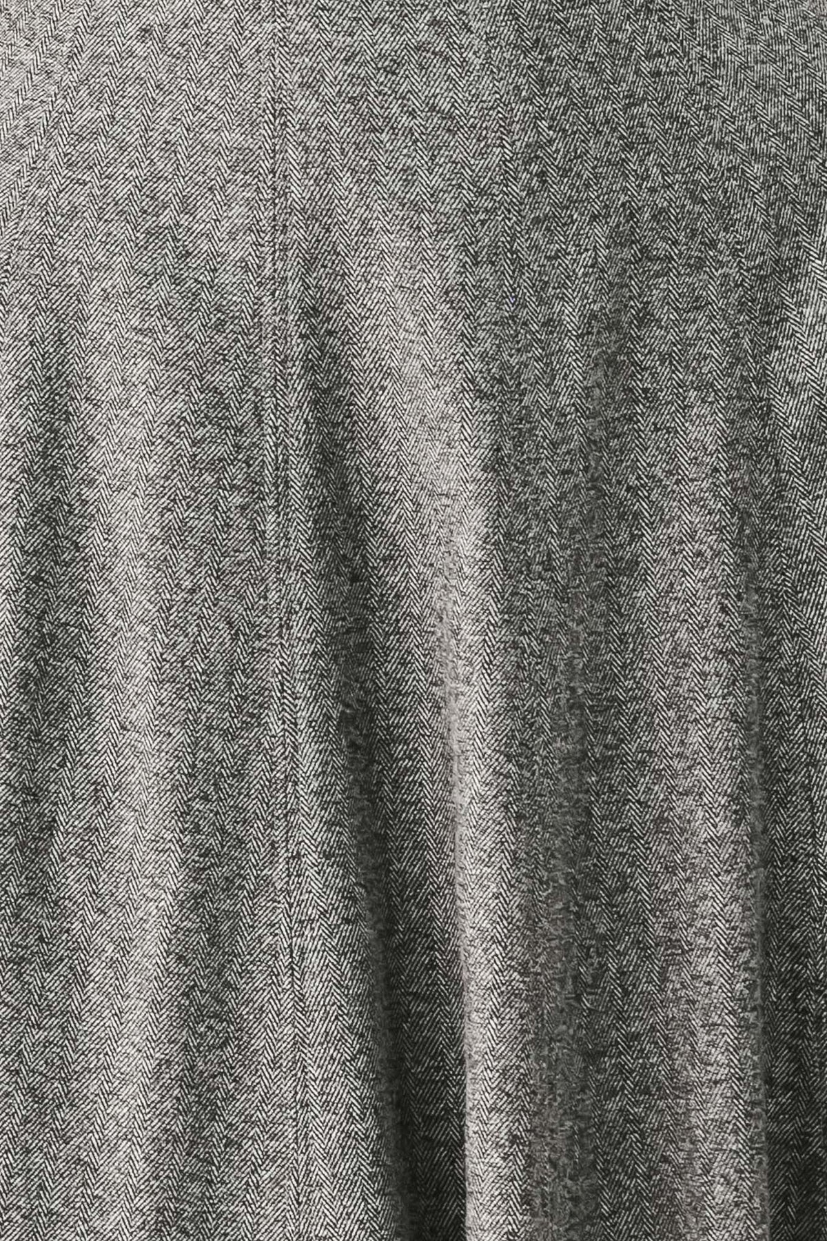A woman modeling a sleeveless gray midi dress with a structured bodice, defined waist, and flared skirt | FREEMARKET