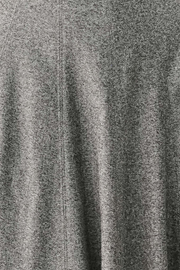 A woman modeling a sleeveless gray midi dress with a structured bodice, defined waist, and flared skirt | FREEMARKET