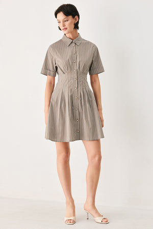Woman wearing a multi colored taupe short sleeve striped woven mini dress with front button closure, corset waist and circle skirt | FREEMARKET