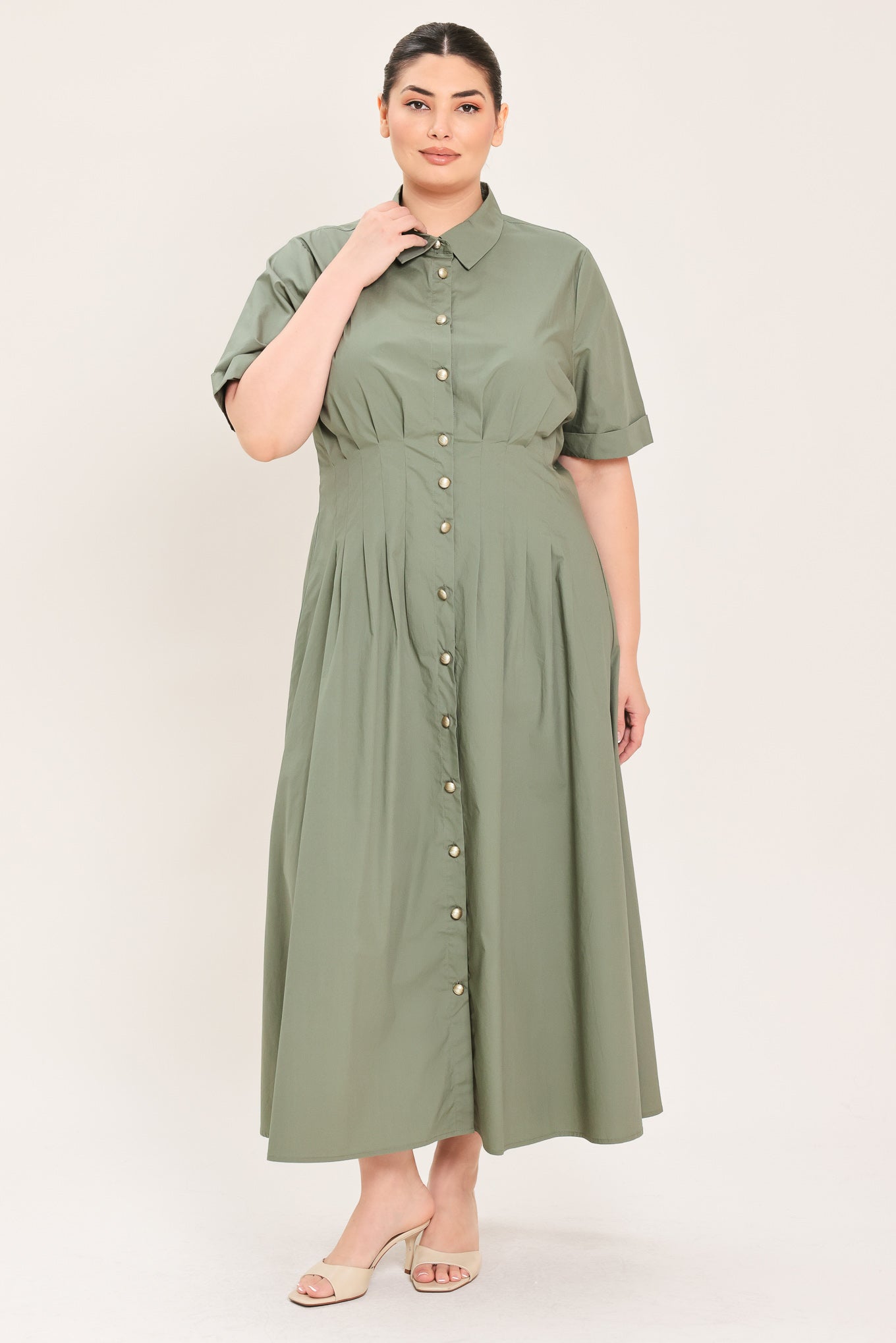 A woman modeling a olive green midi shirt dress with short sleeves, a button-down front, and a gathered waist | Plus Curve Flying Tomato