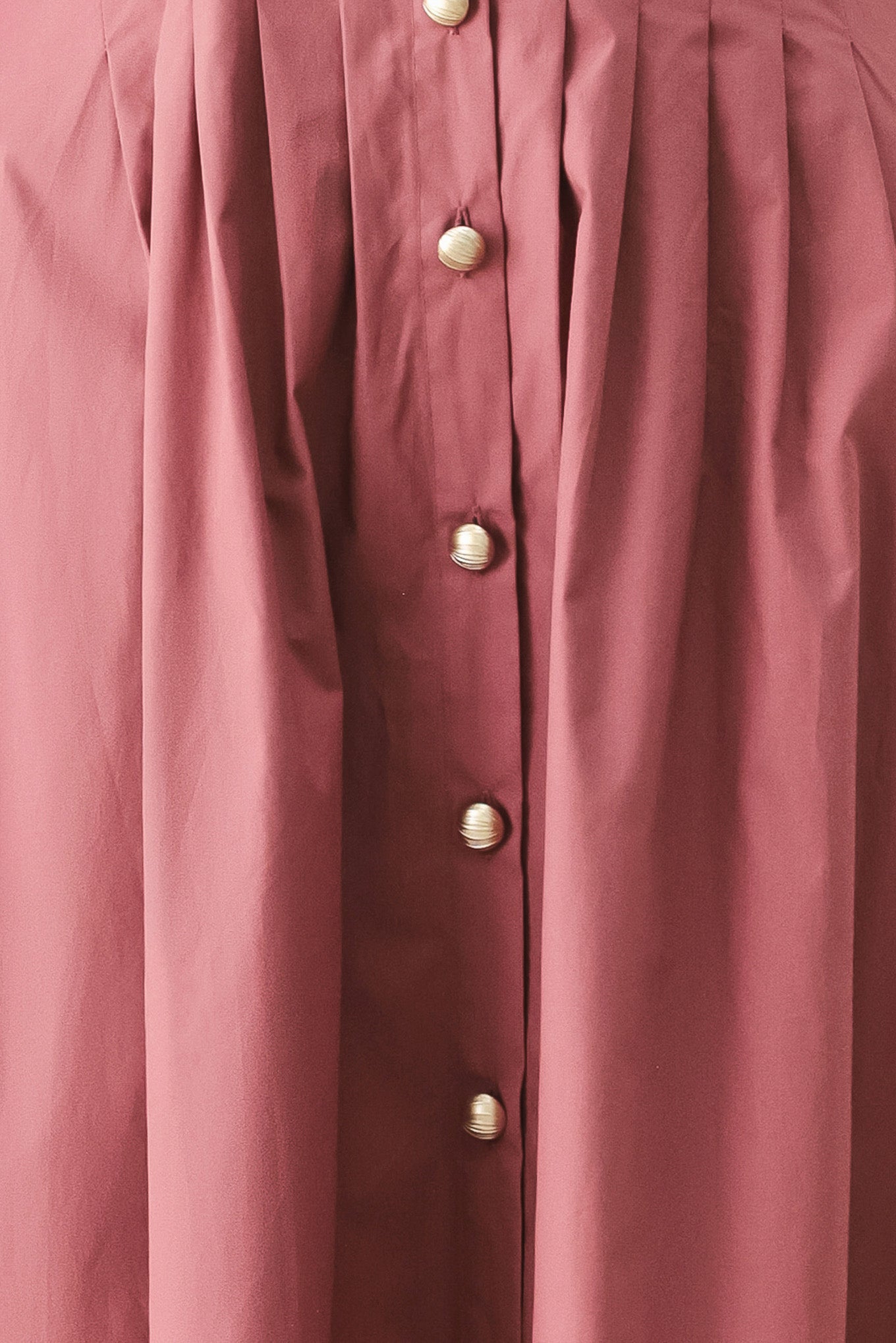 Woman wearing a mauve pink midi dress featuring collar, short sleeve, button down, corset waist, side pockets and full skirt | FREEMARKET