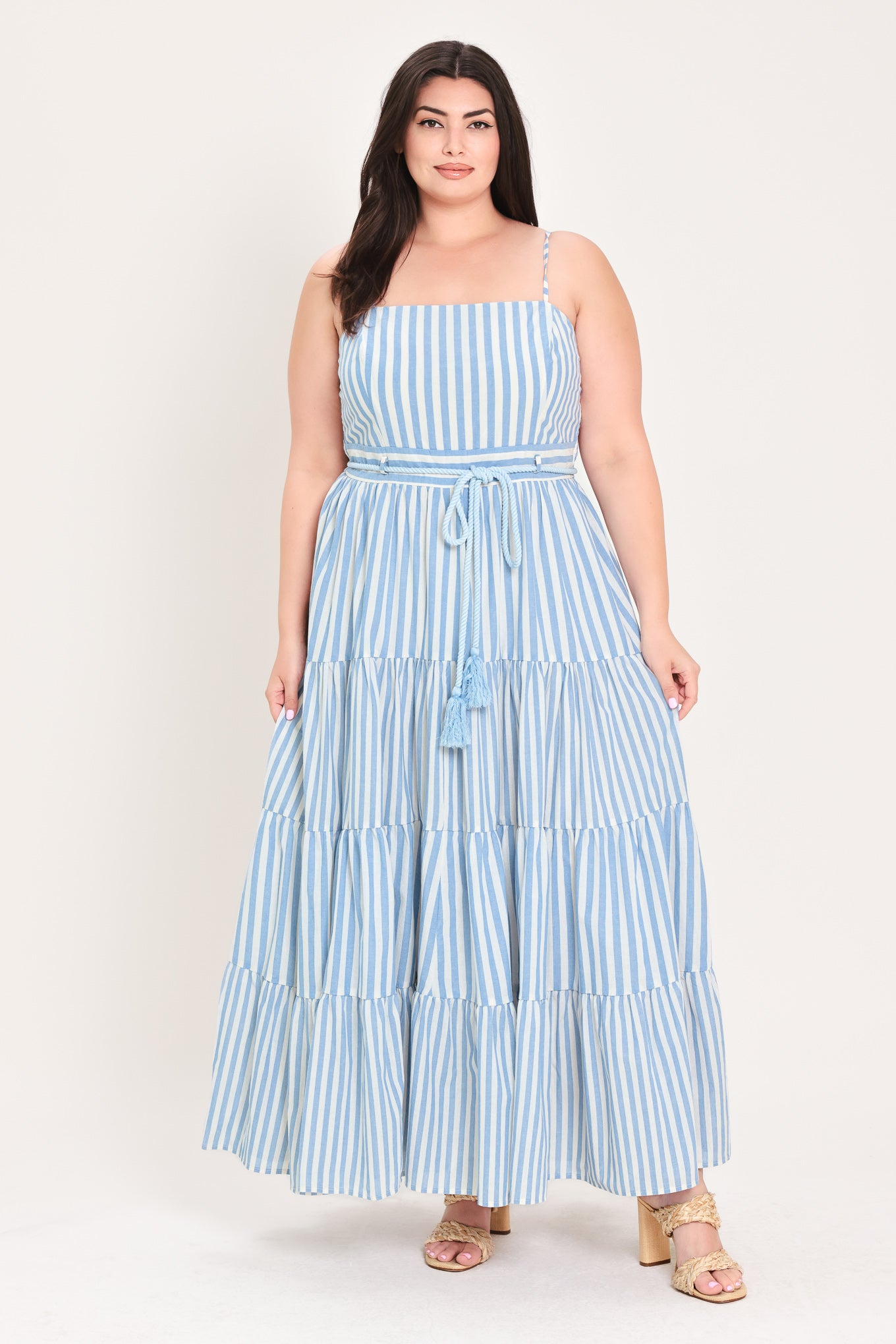 Woman wearing a blue and white striped maxi dress with a self tie belt | Flying Tomato Curve