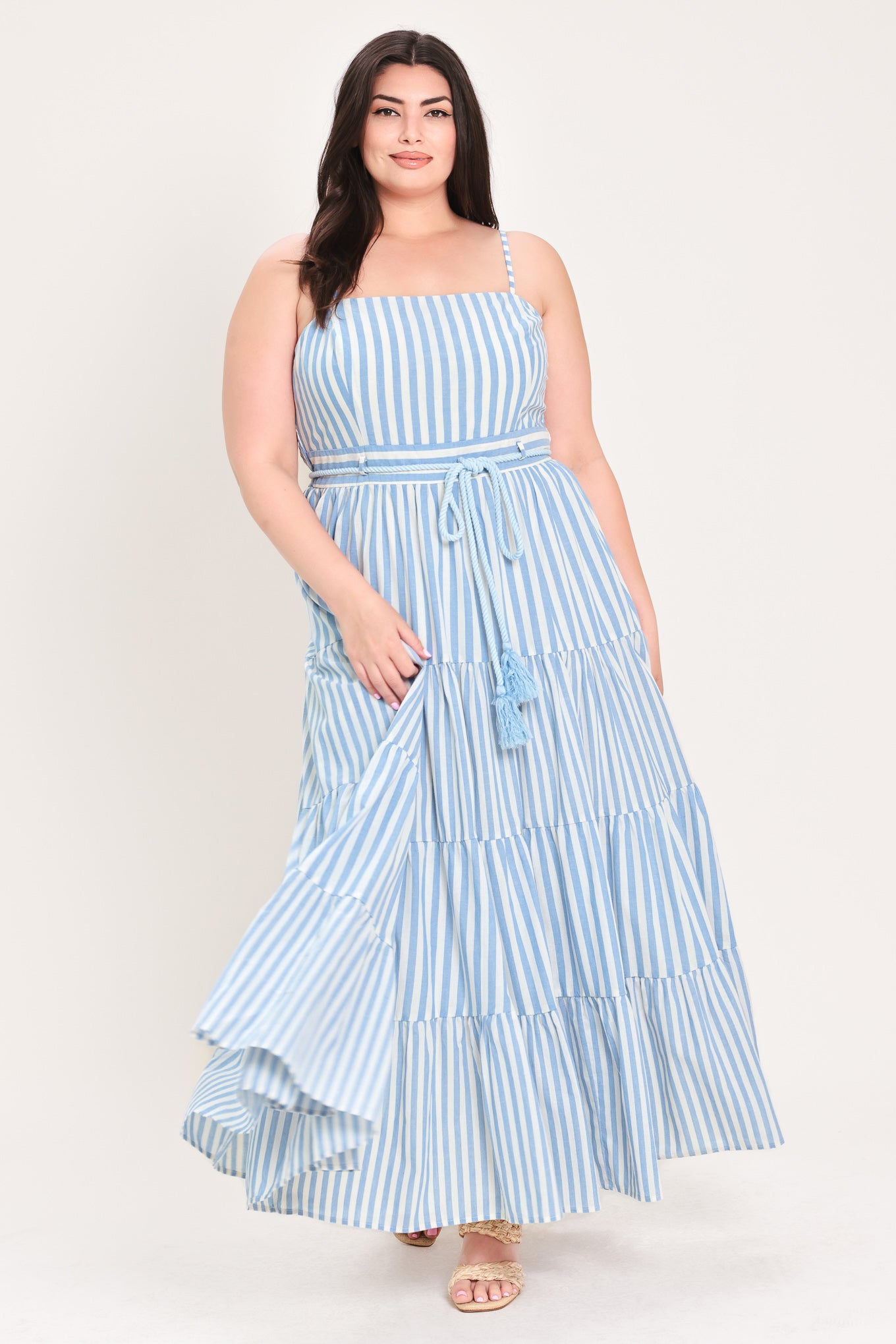 Woman wearing a blue and white striped maxi dress with a self tie belt | Flying Tomato Curve