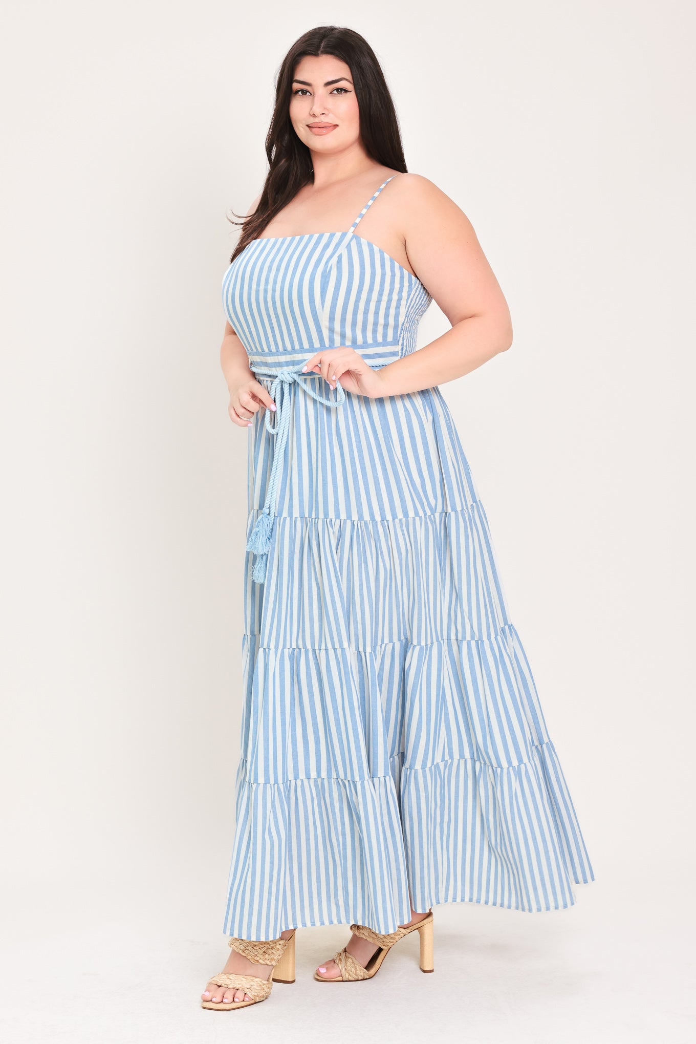 Woman wearing a blue and white striped maxi dress with a self tie belt | Flying Tomato Curve