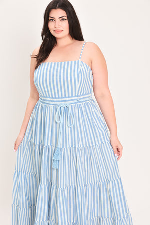 Woman wearing a blue and white striped maxi dress with a self tie belt | Flying Tomato Curve