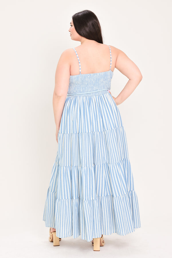 Woman wearing a blue and white striped maxi dress with a self tie belt | Flying Tomato Curve