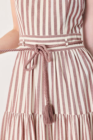 Close up of a burgundy striped woven ankle dress featuring straight neckline, straps, rope tie, tier skirt and back zipper closure | FREEMARKET