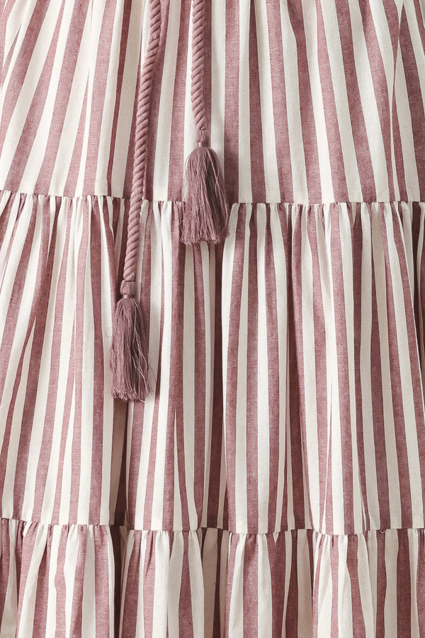 Close up of a burgundy striped woven ankle dress featuring straight neckline, straps, rope tie, tier skirt and back zipper closure | FREEMARKET