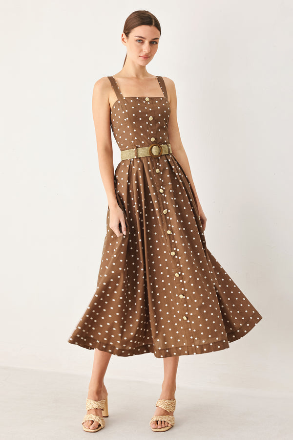 Woman wearing a brown with white polka dot midi dress featuring straight neckline, straps, button down detail, contrasting belt, full skirt and back zipper closure | FREEMARKET