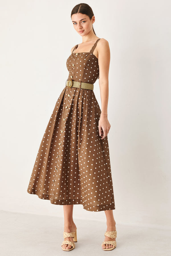 Woman wearing a brown with white polka dot midi dress featuring straight neckline, straps, button down detail, contrasting belt, full skirt and back zipper closure | FREEMARKET