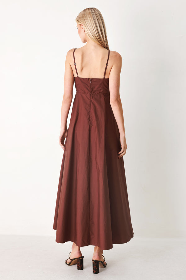 Woman wearing a dark rose midi dress featuring straight neckline, straps, circle skirt and back zipper closure | FREEMARKET