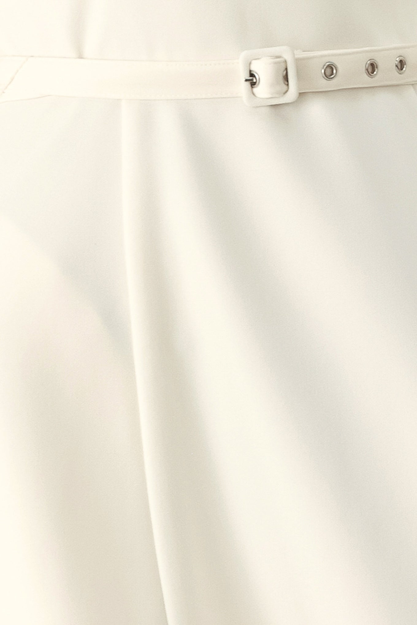 Woman wearing an ivory midi dress with cut-out design featuring cam top, cut out at waistline, self belt, circle skirt and back zipper closure | FREEMARKET