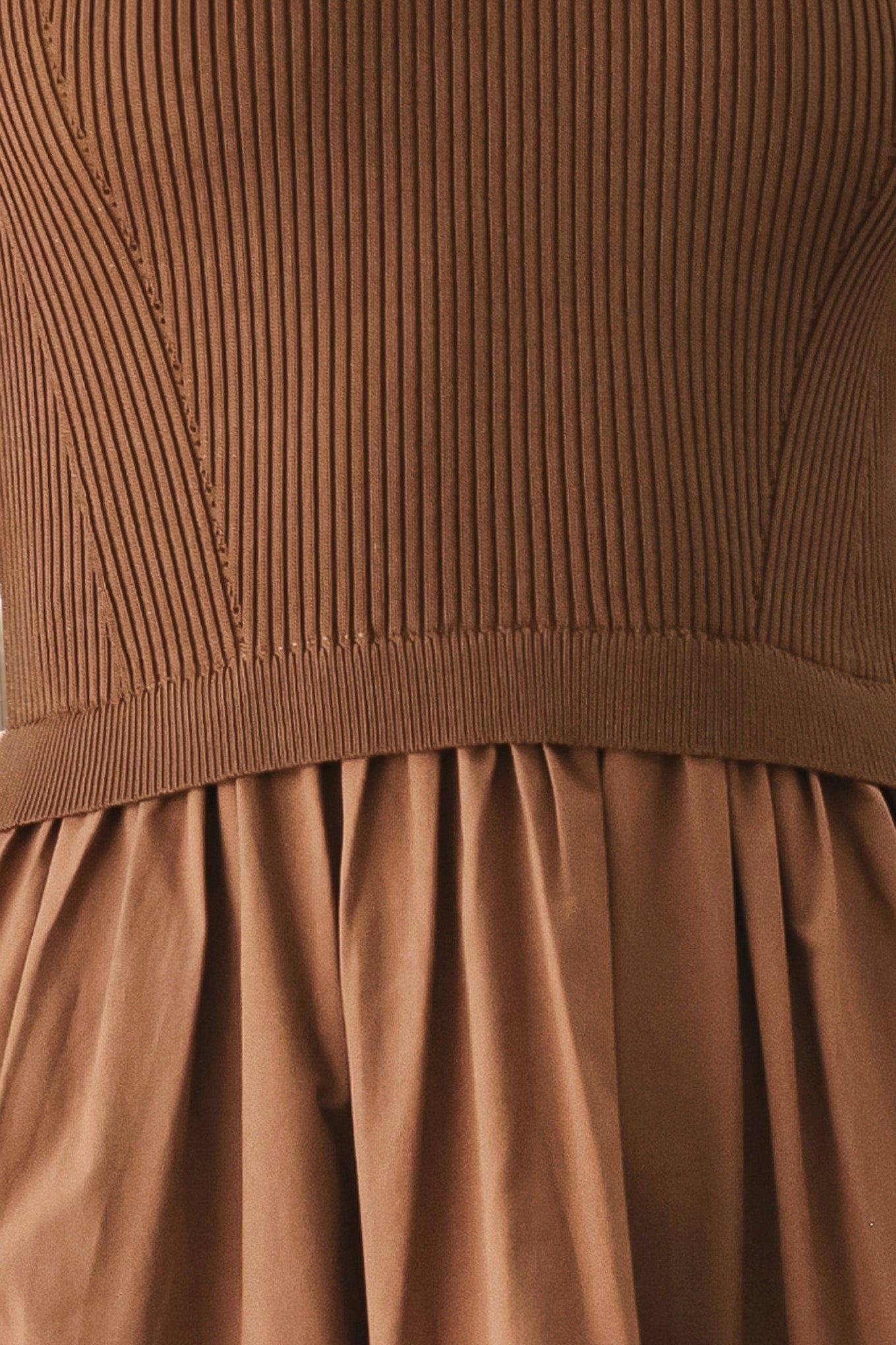 Woman wearing a brown sleeveless  sweater knit and woven mix midi dress featuring round neckline and tier skirt | FREEMARKET