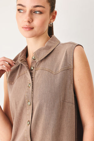 Woman wearing a sleeveless brown tiered midi dress featuring collar, button down, self tie and tier skirt | FREEMARKET