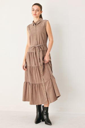 Woman wearing a sleeveless brown tiered midi dress featuring collar, button down, self tie and tier skirt | FREEMARKET