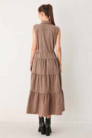Woman wearing a sleeveless brown tiered midi dress featuring collar, button down, self tie and tier skirt | FREEMARKET