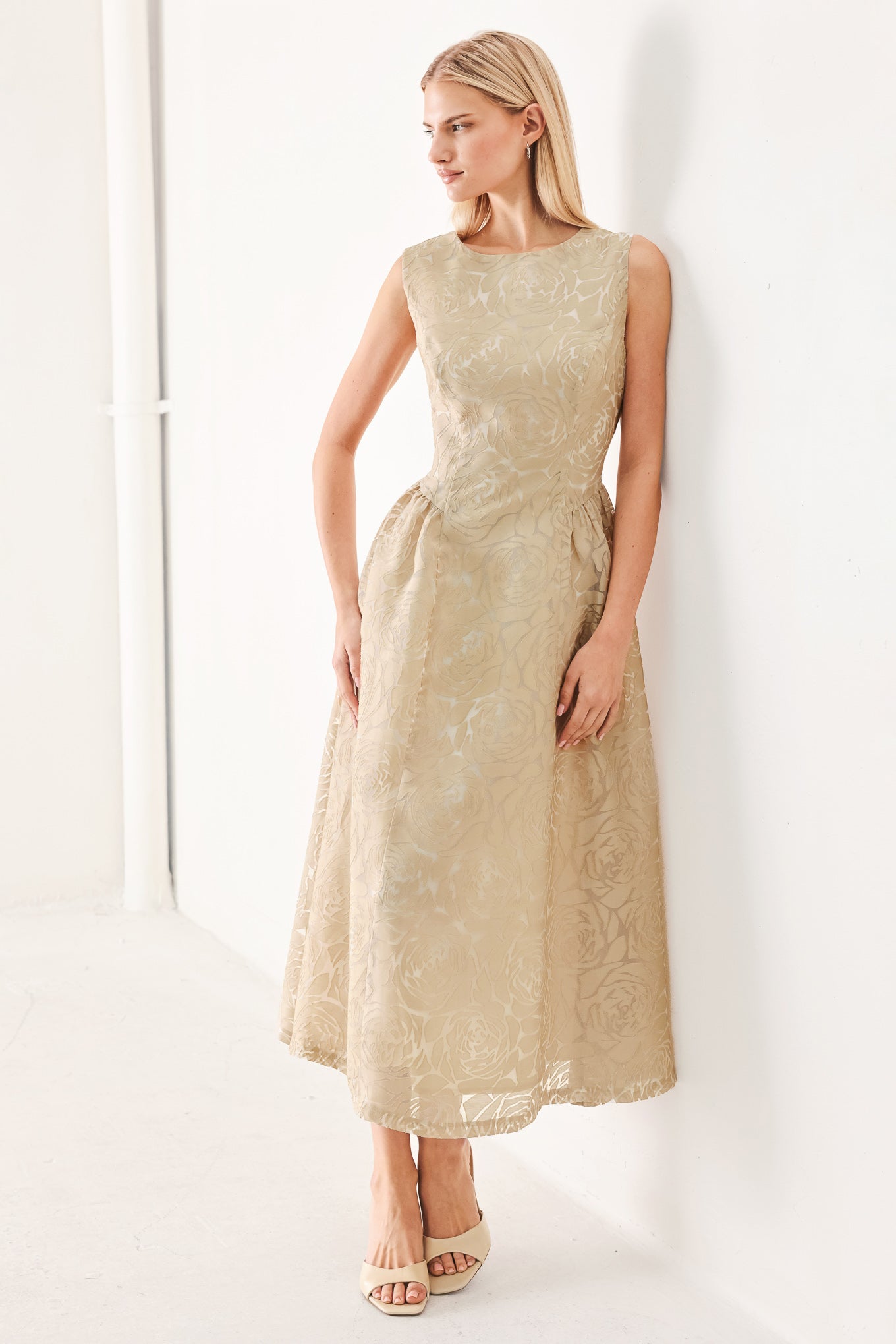 Woman wearing a beige lace burnout organza midi dress featuring round neckline, sleeveless, side shirring detail and back zipper closure | FREEMARKET