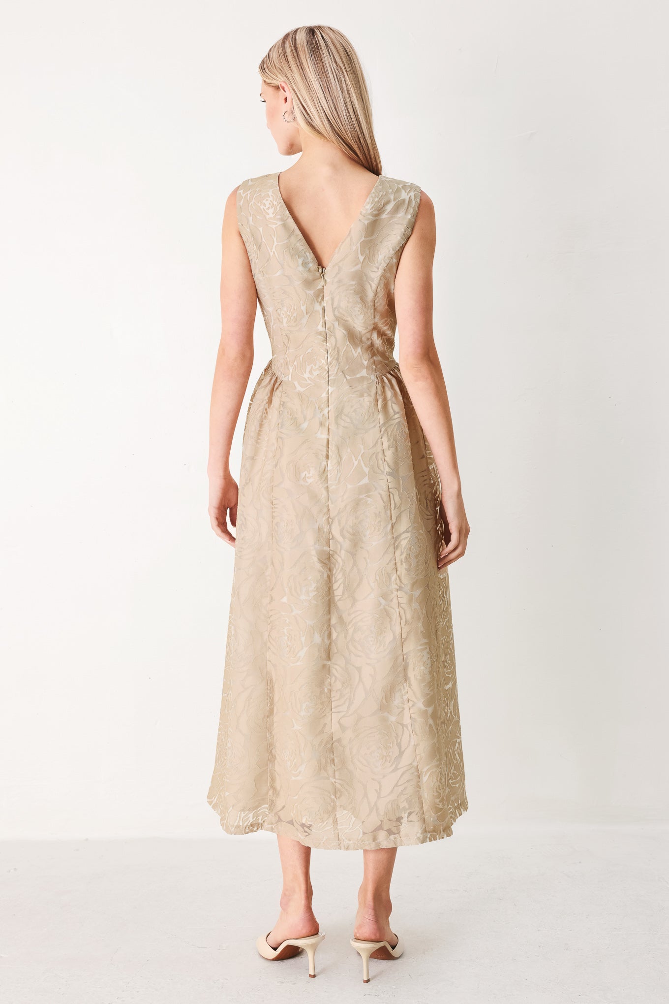 Woman wearing a beige lace burnout organza midi dress featuring round neckline, sleeveless, side shirring detail and back zipper closure | FREEMARKET