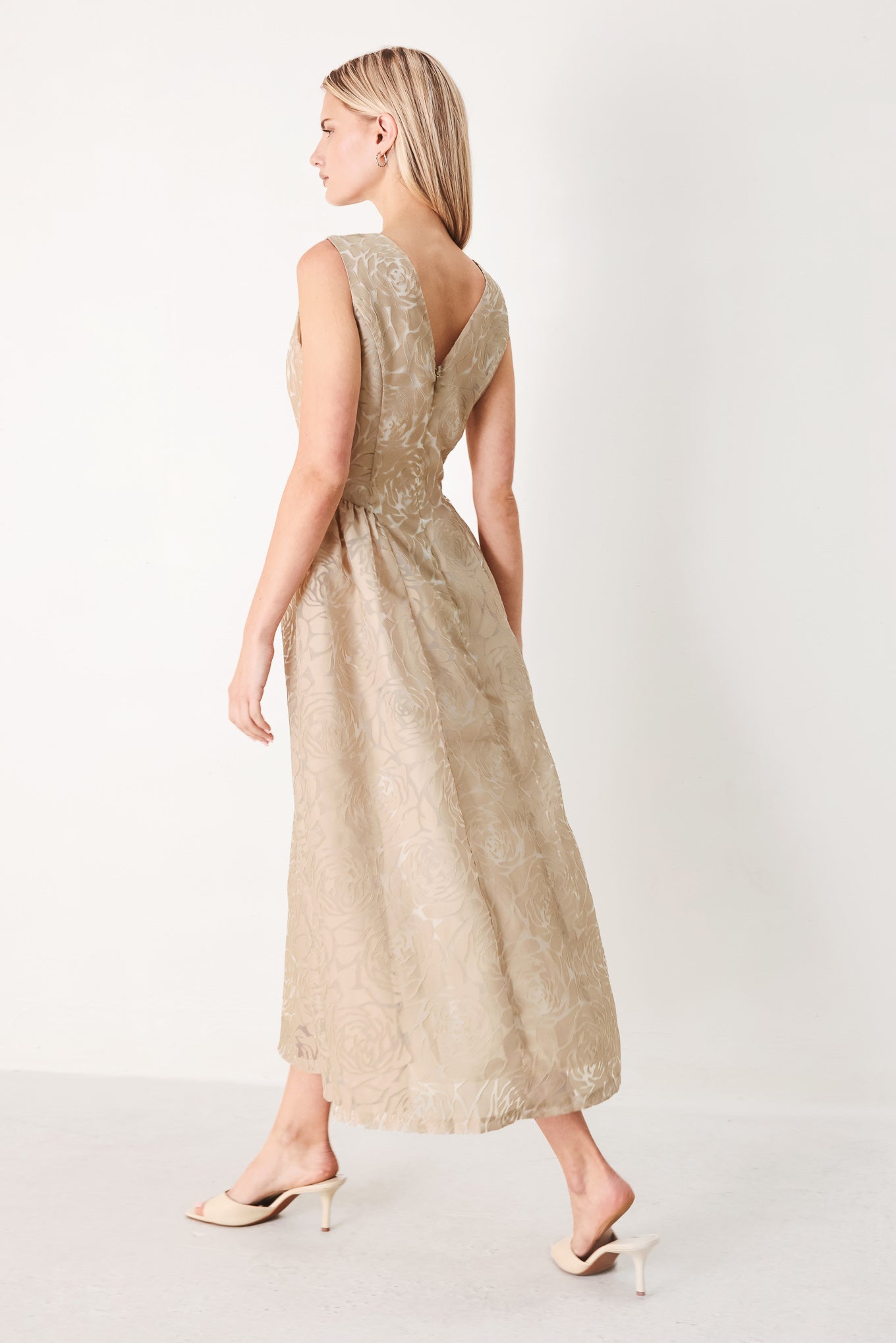 Woman wearing a beige lace burnout organza midi dress featuring round neckline, sleeveless, side shirring detail and back zipper closure | FREEMARKET