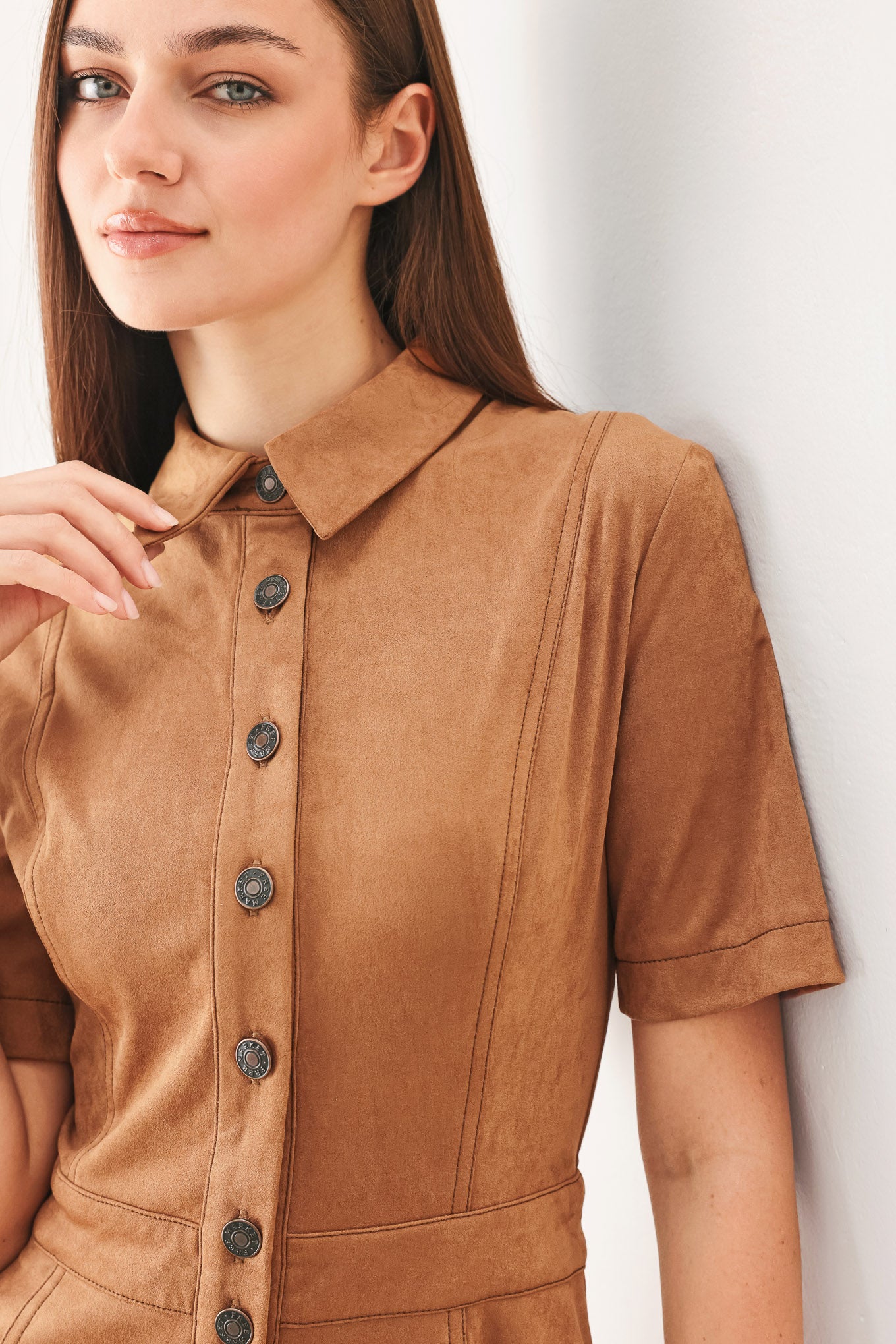 Woman wearing a camel brown faux suede midi shirt dress with short sleeve, front button down and circle skirt | FREEMARKET