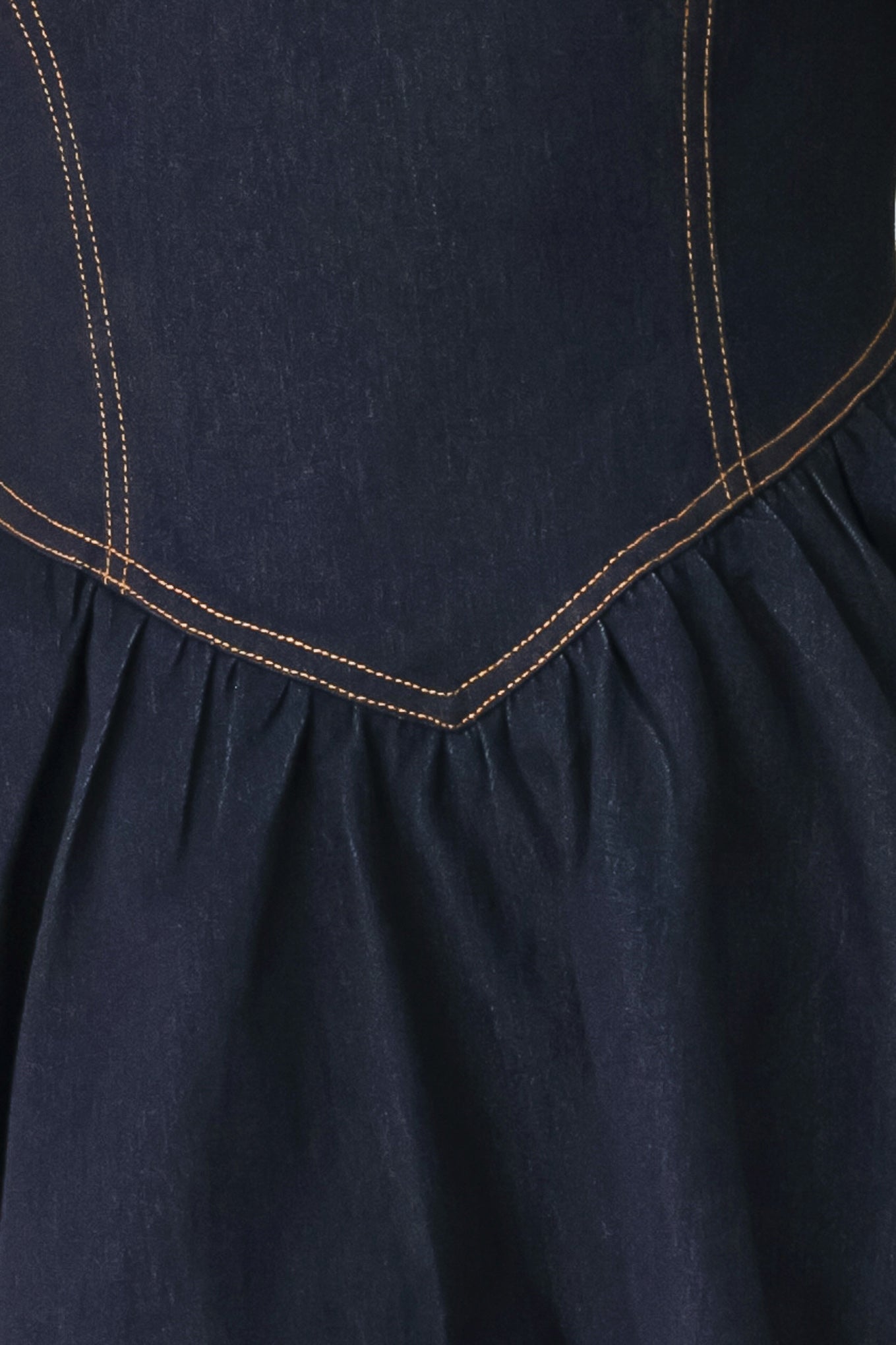 Woman wearing a dark denim navy blue mini dress featuring round neckline, short puff sleeve, basque waist, double layer skirt and back zipper closure | FREEMARKET