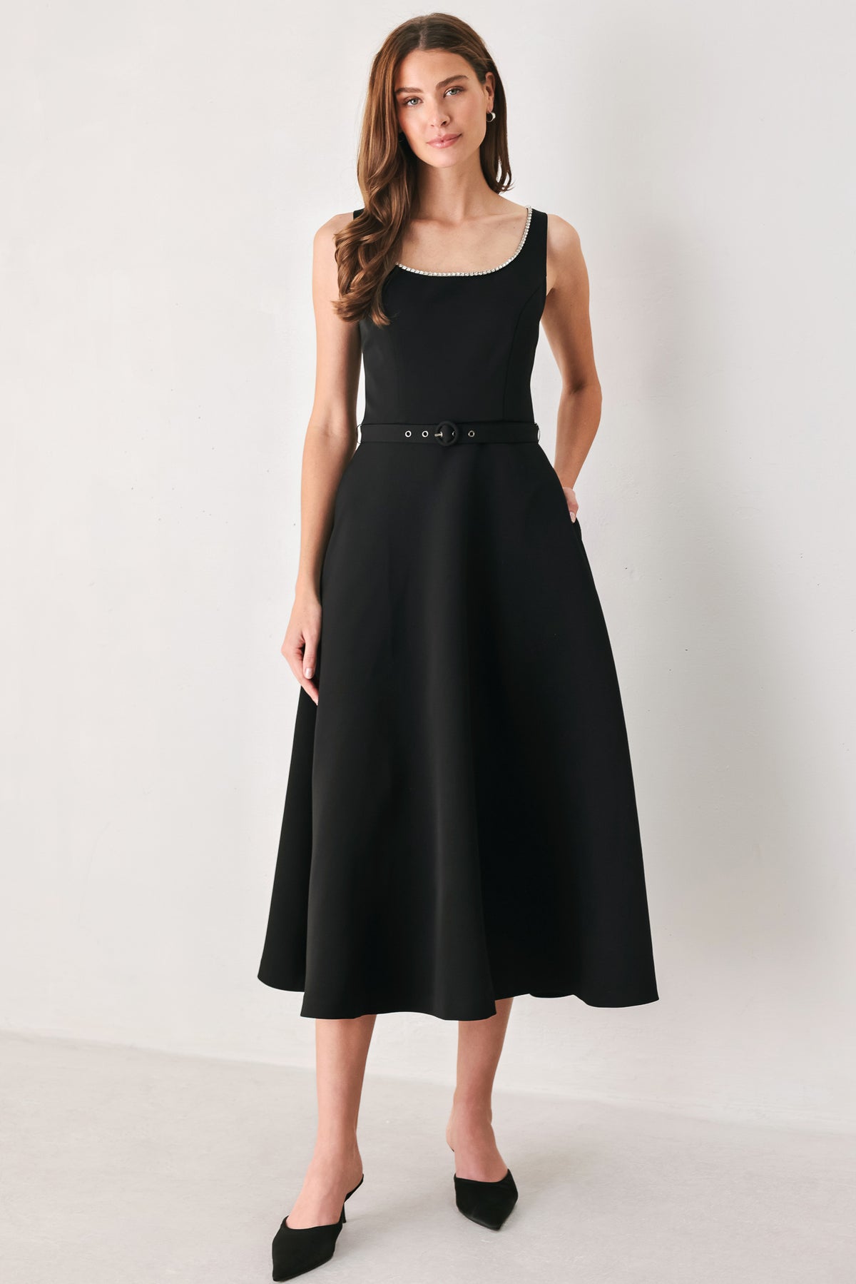 Woman wearing a black u-neckline with embellishments midi dress and matching thin waist belt | Flying Tomato