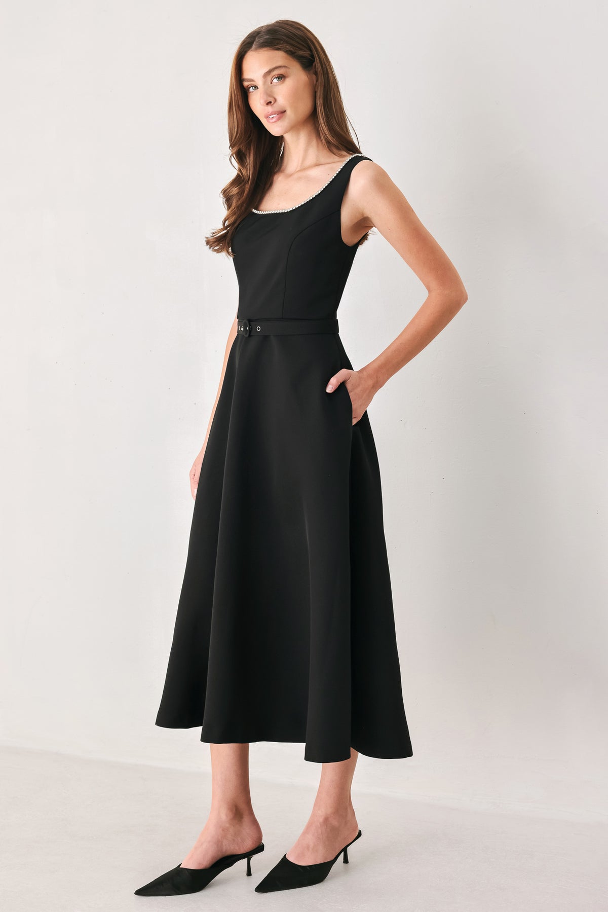 Woman wearing a black u-neckline with embellishments midi dress and matching thin waist belt | Flying Tomato