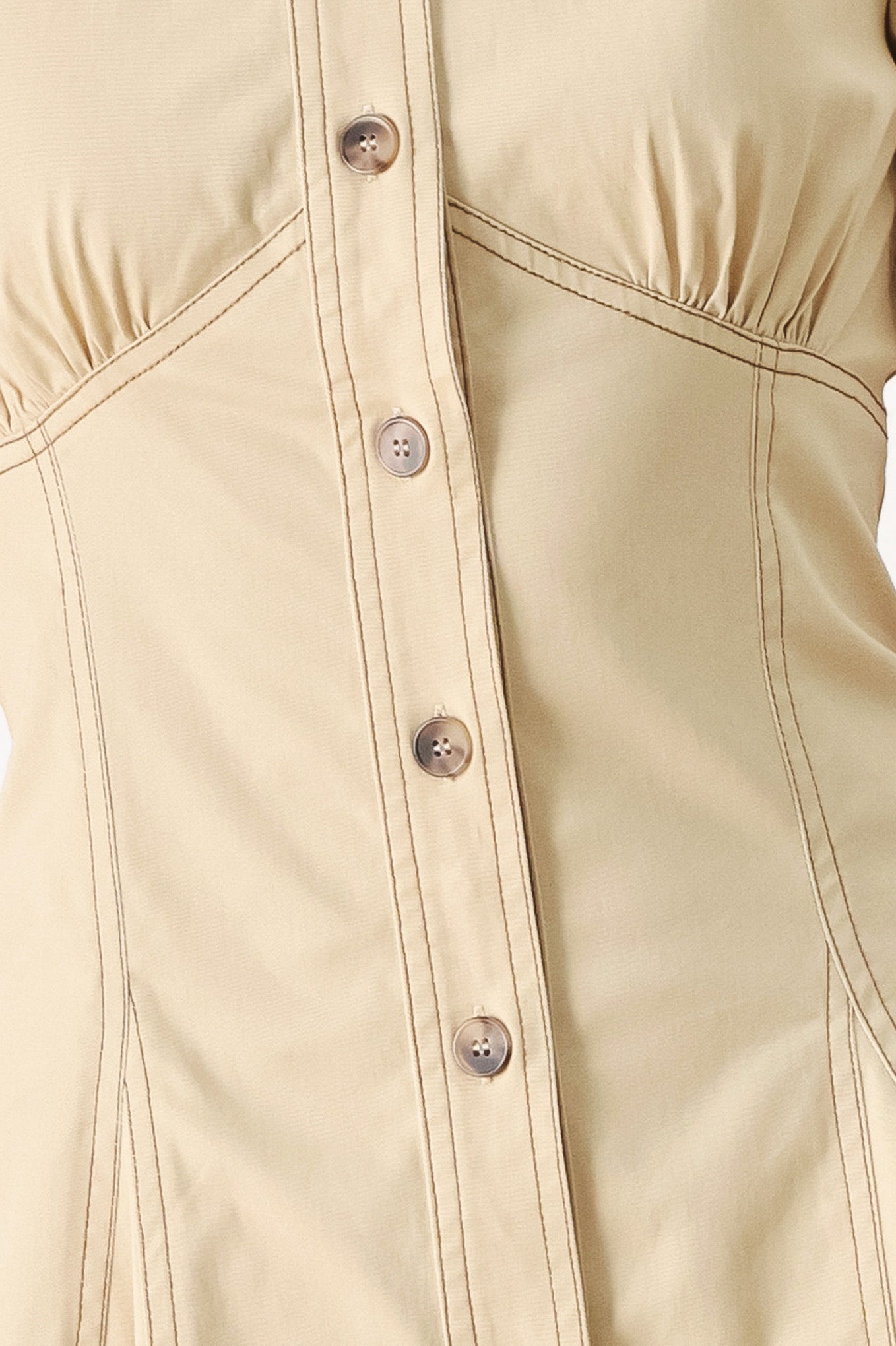 Woman wearing a khaki midi dress with front button down, short sleeve and circle skirt | FREEMARKET