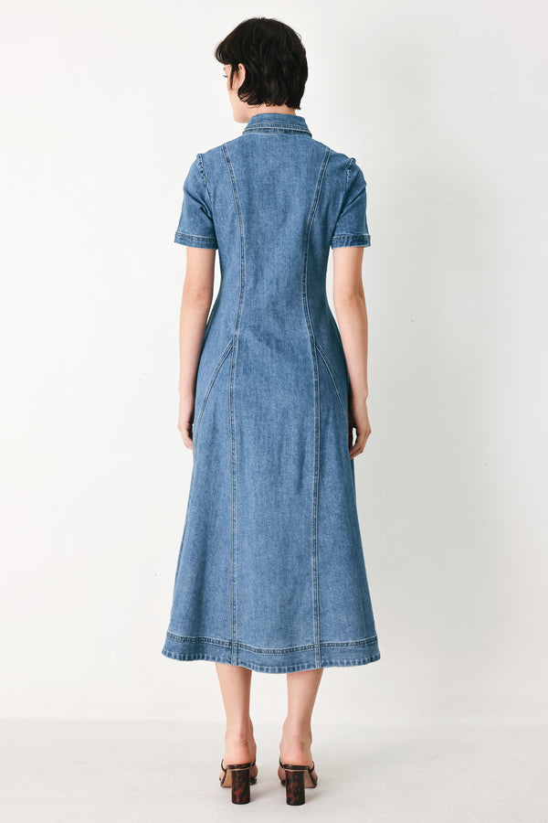 Woman wearing a blue denim midi shirt dress with front closure and circle skirt | FREEMARKET
