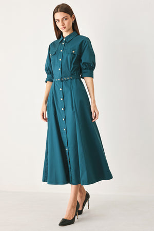 Woman wearing a teal blue midi dress featuring collar, elbow sleeve, front button down, self belt and circle skirt | FREEMARKET