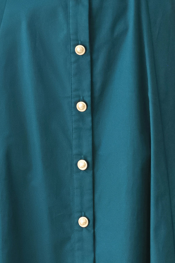 Woman wearing a teal blue midi dress featuring collar, elbow sleeve, front button down, self belt and circle skirt | FREEMARKET