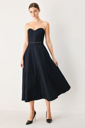 Woman wearing a dark denim strapless midi dress featuring a sweetheart neckline, self belt, circle skirt and back zipper closure | FREEMARKET