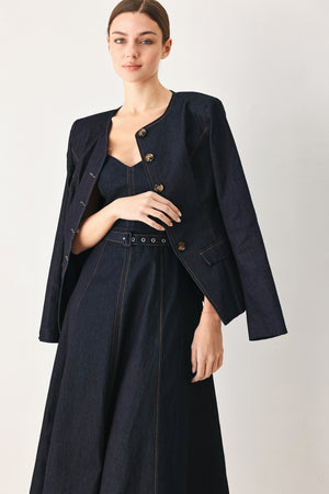 Woman wearing a dark denim strapless midi dress featuring a sweetheart neckline, self belt, circle skirt and back zipper closure | FREEMARKET