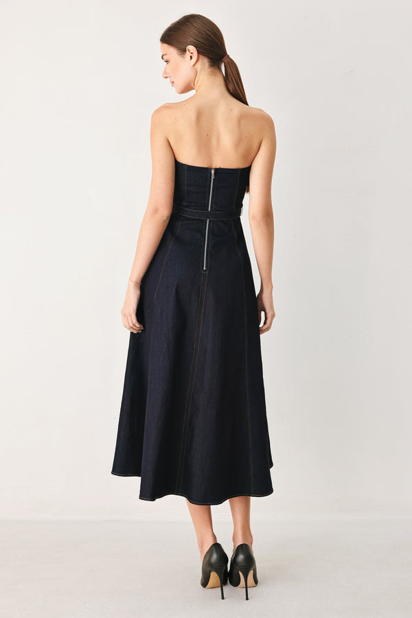 Woman wearing a dark denim strapless midi dress featuring a sweetheart neckline, self belt, circle skirt and back zipper closure | FREEMARKET