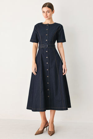 Woman wearing a navy dark denim midi dress with buttons and waist belt | FREEMARKET