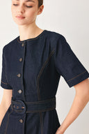 Woman wearing a navy dark denim midi dress with buttons and waist belt | FREEMARKET