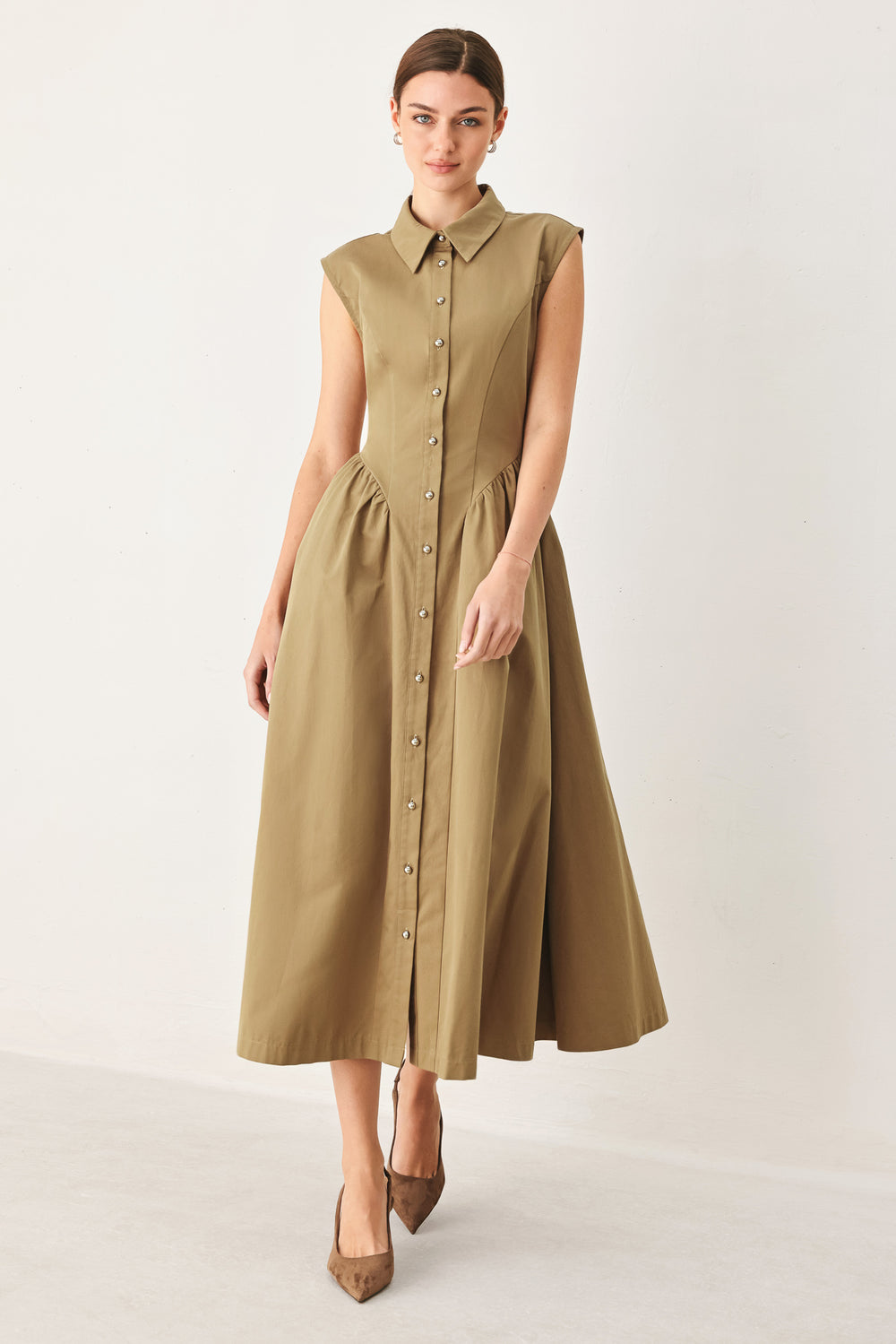 Woman wearing a sleeveless mocha woven midi dress featuring collar, button down and side shirred skirt | FREEMARKET