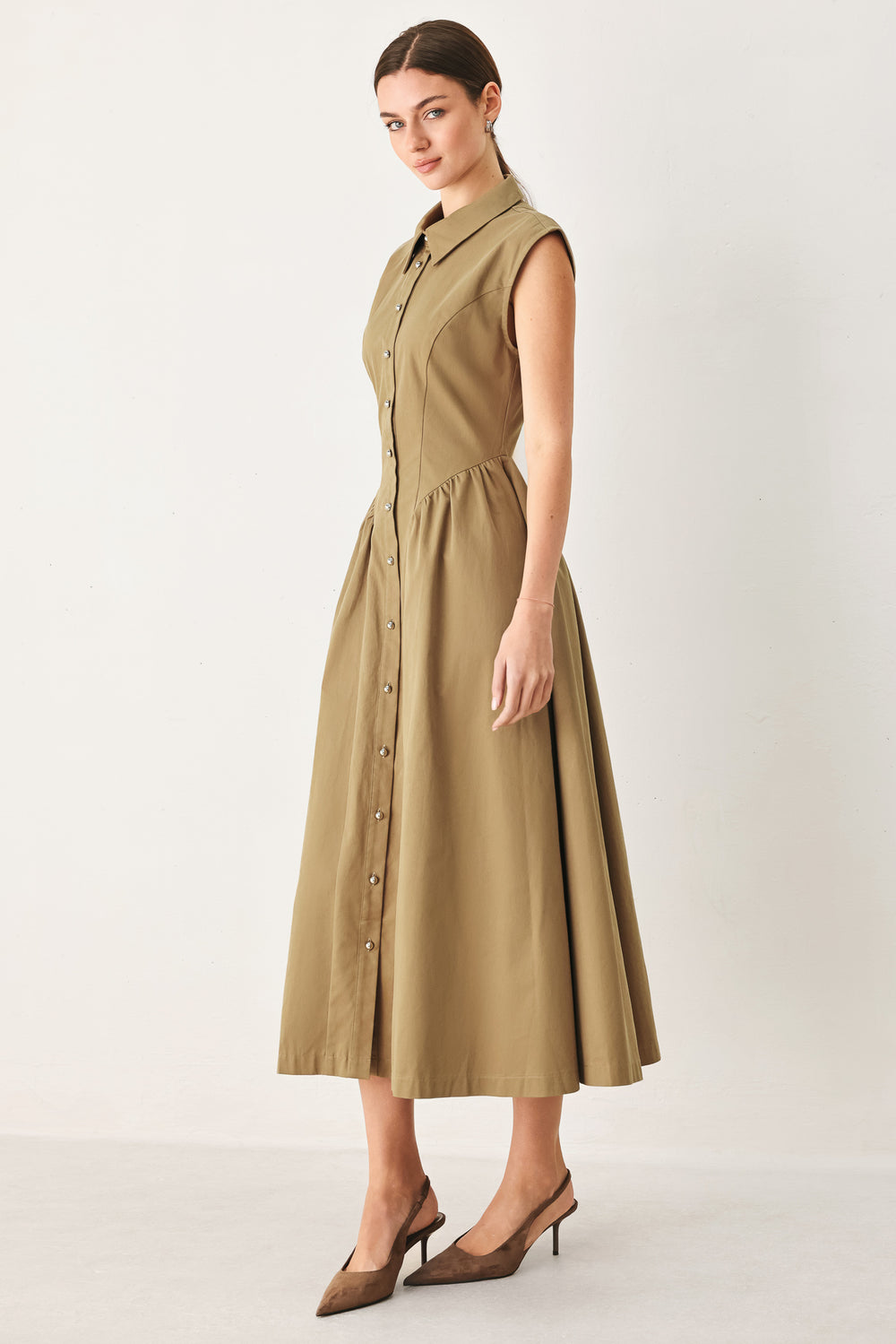 Woman wearing a sleeveless mocha woven midi dress featuring collar, button down and side shirred skirt | FREEMARKET